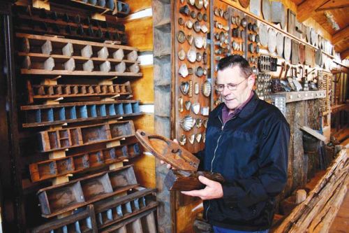 Vernon Wheeler with his vast collection of maple sugar moulds, photo courtesy of the Wheelers.